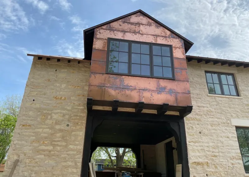 Copper metal panel facade on a stone building for Metal Roof Coating in Fair Oaks